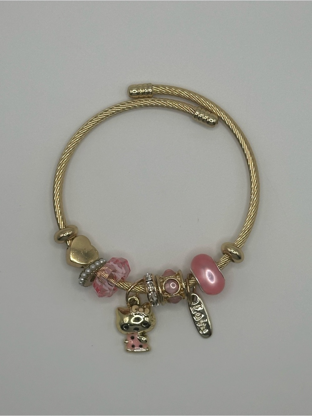 Gold-Tone Hello Kitty Charm Bracelet with Pink Beads